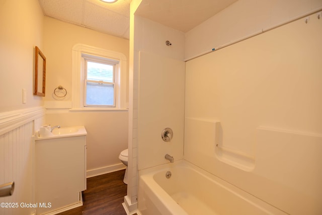 full bathroom featuring toilet, wood-type flooring, shower / washtub combination, and vanity