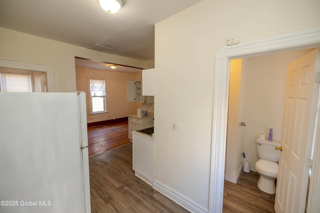 hall with dark hardwood / wood-style floors