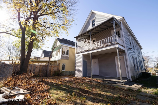 rear view of property with a balcony