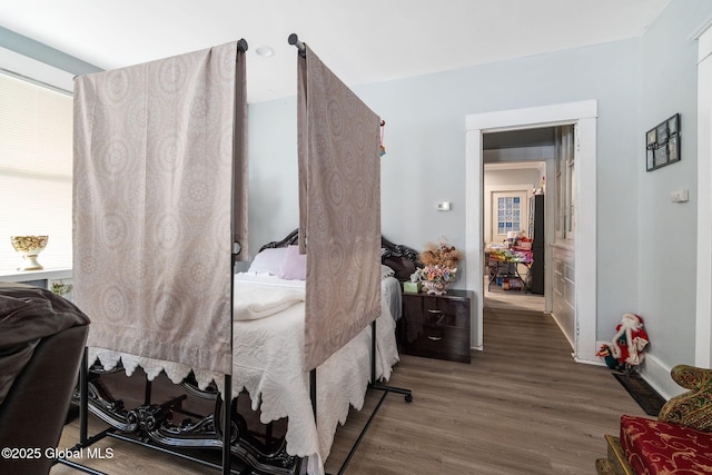 bedroom with wood-type flooring