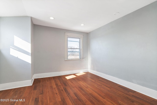 empty room with hardwood / wood-style flooring