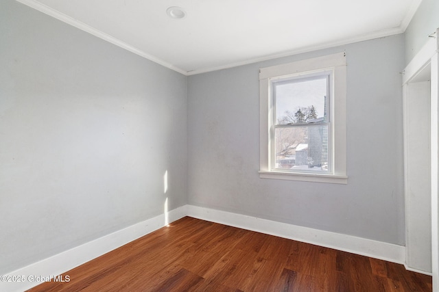 unfurnished room with crown molding and dark hardwood / wood-style floors