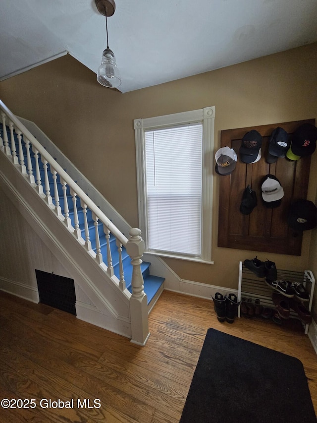 stairway with wood-type flooring