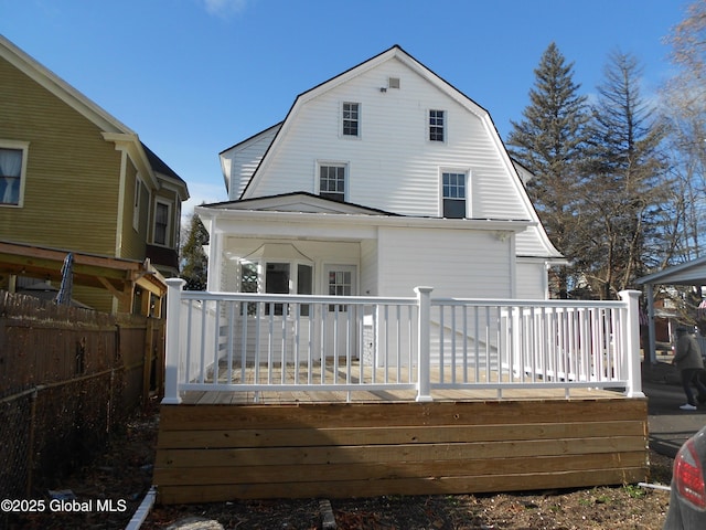 back of property with a deck