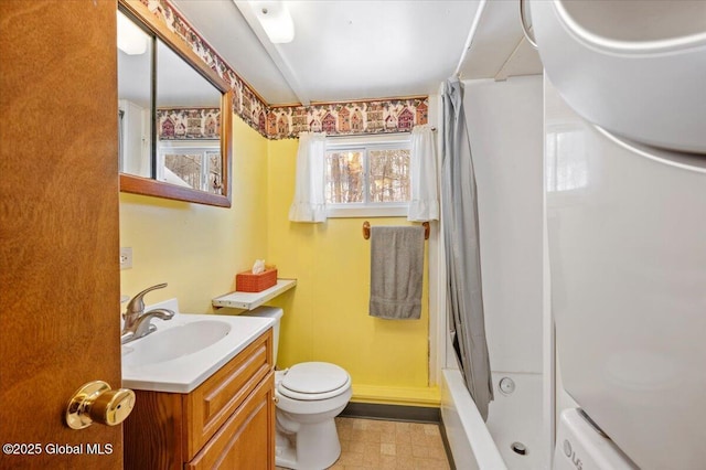 full bathroom with vanity, toilet, and shower / bath combo with shower curtain