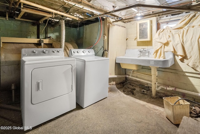 washroom featuring sink and independent washer and dryer