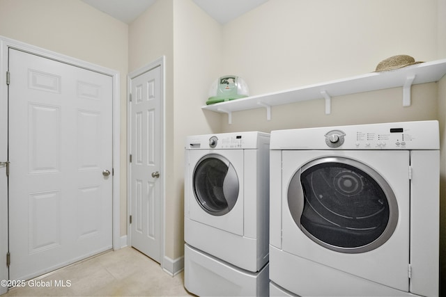 laundry area with independent washer and dryer