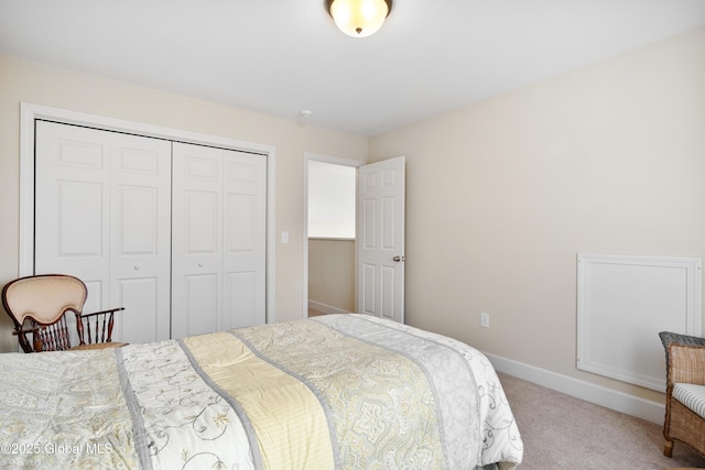 bedroom featuring light carpet and a closet