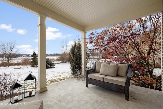 view of snow covered patio