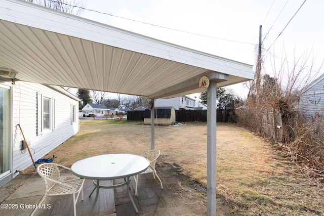 view of patio with a shed