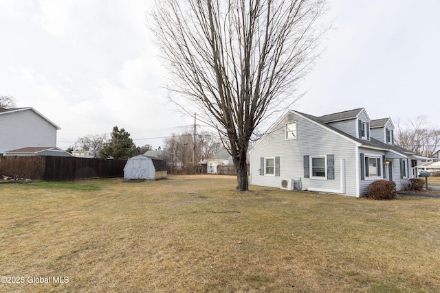 exterior space with a lawn and a storage unit