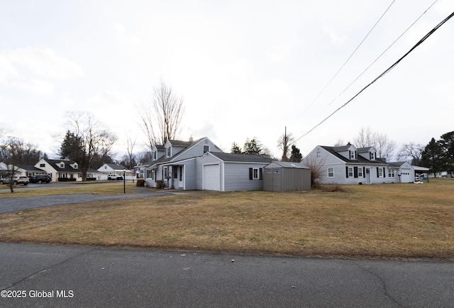 view of home's exterior with a lawn and a garage