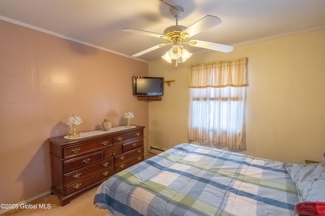 carpeted bedroom with a baseboard heating unit, ceiling fan, and crown molding