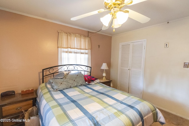 bedroom featuring a closet, ceiling fan, carpet, and ornamental molding