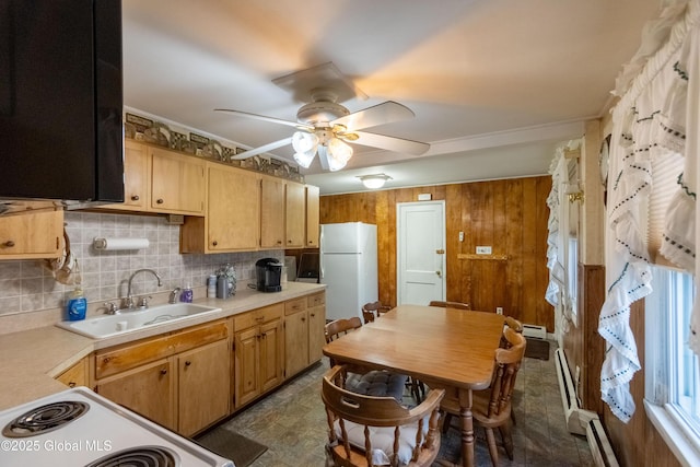 kitchen featuring white appliances, ceiling fan, ornamental molding, sink, and a baseboard radiator