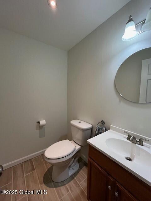 bathroom featuring toilet and vanity