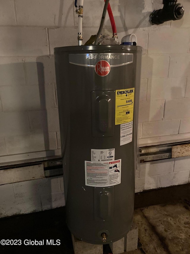 utility room featuring water heater