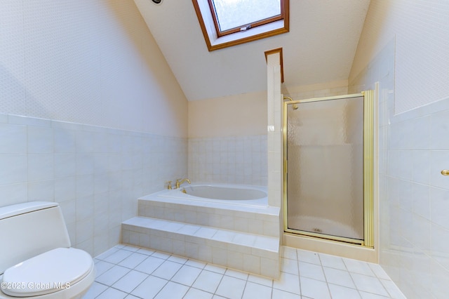 bathroom with toilet, tile patterned flooring, vaulted ceiling with skylight, and independent shower and bath