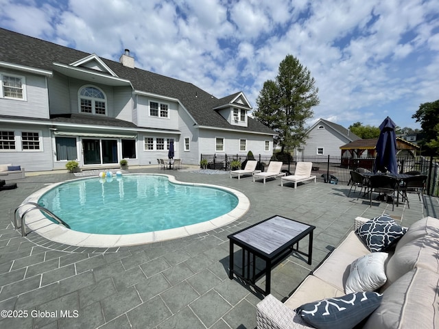 view of swimming pool with a patio area and outdoor lounge area