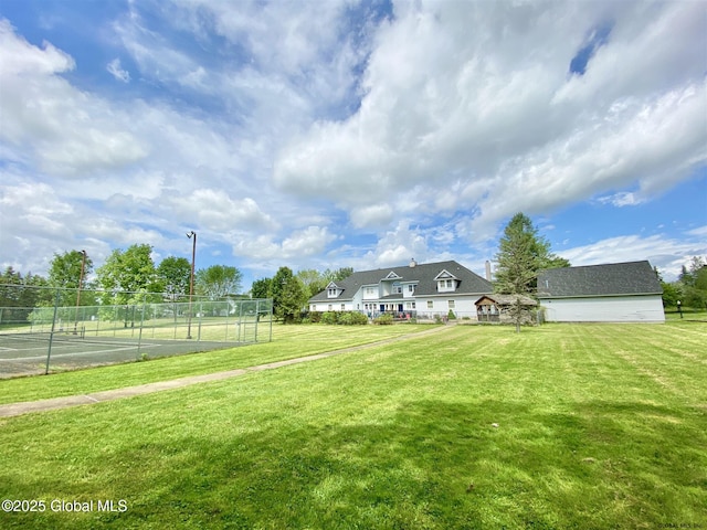 view of yard with tennis court