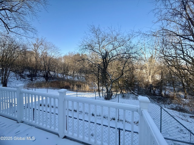 view of yard layered in snow