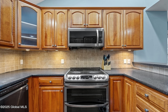 kitchen featuring stainless steel appliances and decorative backsplash