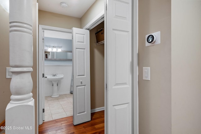 hall with hardwood / wood-style flooring