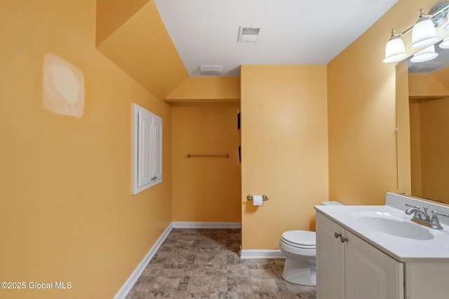 bathroom with toilet and vanity