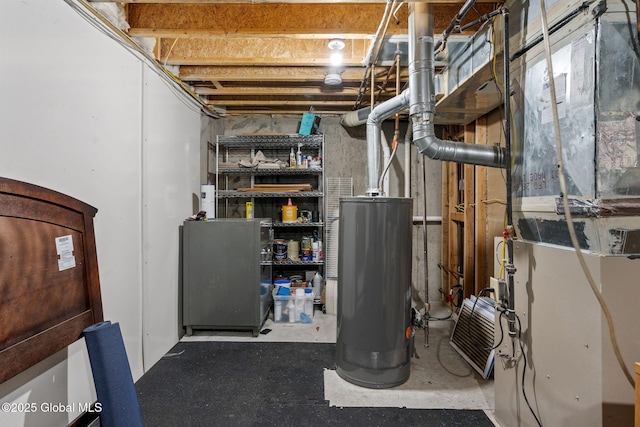 utility room with heating unit and water heater