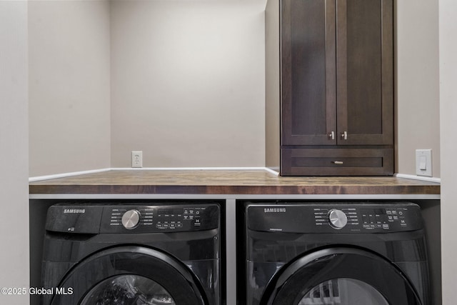 clothes washing area featuring washer and clothes dryer