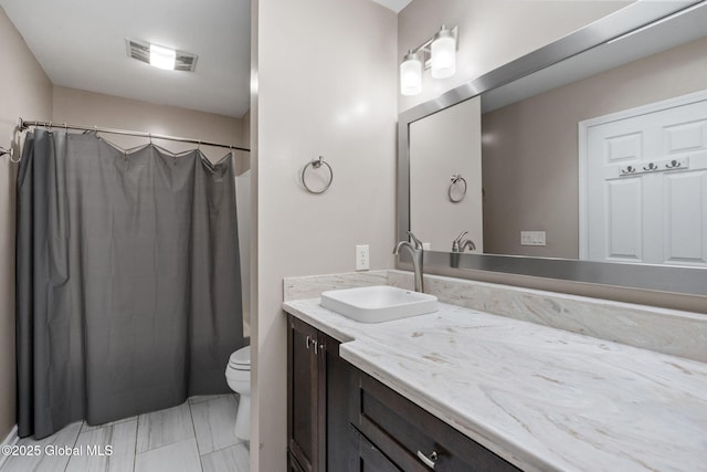 full bathroom with toilet, shower / bathtub combination with curtain, and vanity