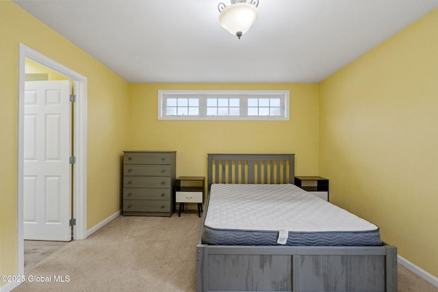 bedroom featuring light colored carpet