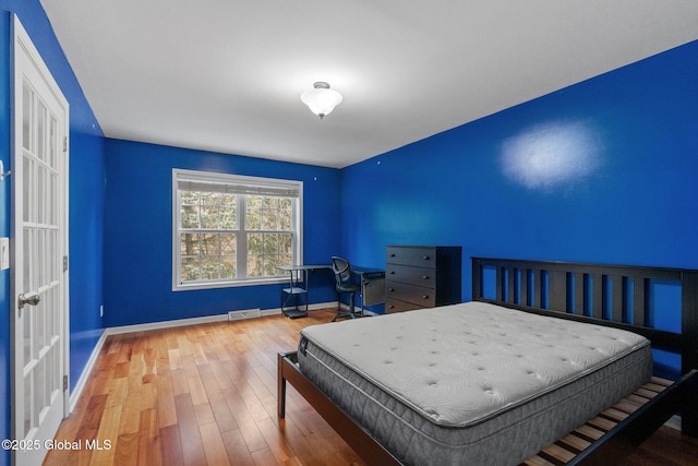 bedroom featuring wood-type flooring