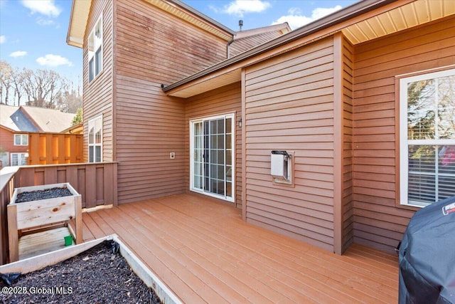 wooden deck with area for grilling