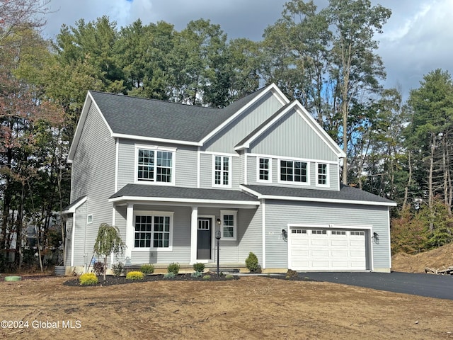 view of front of house with a garage and covered porch