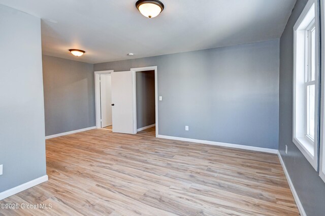 5 E Green St, Johnstown, NY 12095 - spare room featuring baseboards and light wood finished floors