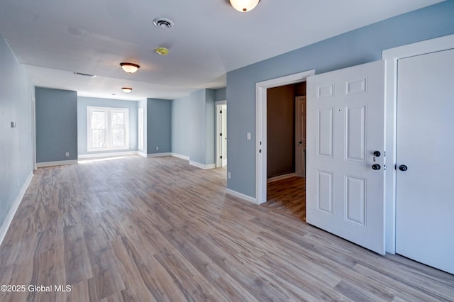 5 E Green St, Johnstown, NY 12095 - unfurnished room with wood finished floors and baseboards