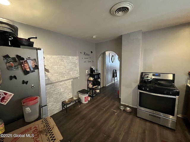 kitchen featuring dark wood-type flooring and appliances with stainless steel finishes