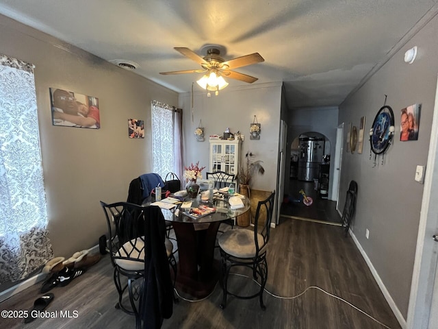 dining room featuring ceiling fan and dark hardwood / wood-style flooring