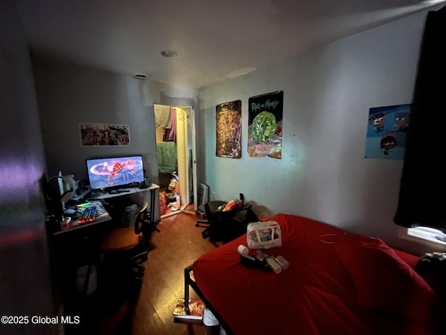 bedroom featuring wood-type flooring