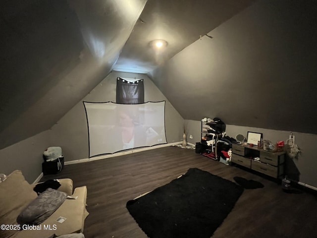 bonus room with hardwood / wood-style flooring and lofted ceiling