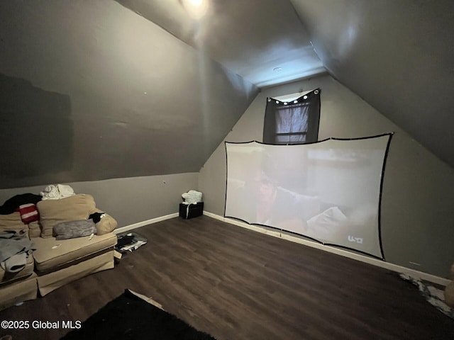 bonus room with wood-type flooring and vaulted ceiling