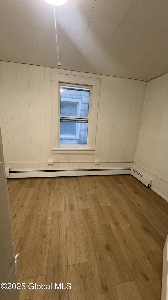 unfurnished room featuring hardwood / wood-style flooring