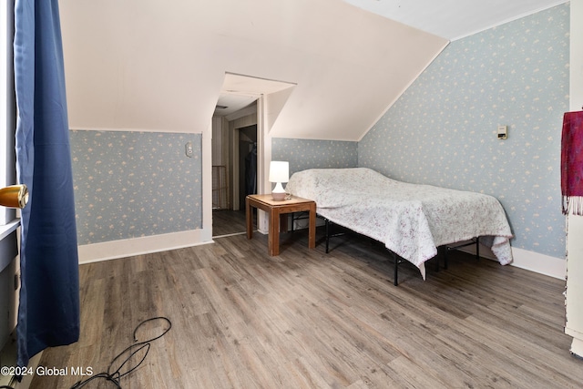 bedroom with hardwood / wood-style flooring