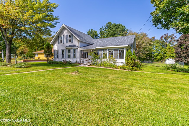 view of property featuring a front lawn