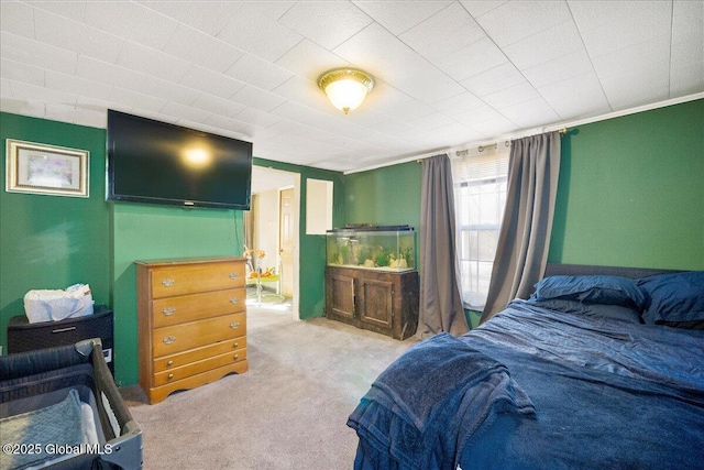 bedroom featuring light carpet and ornamental molding