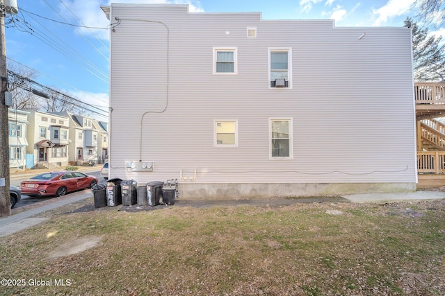 view of property exterior featuring a yard