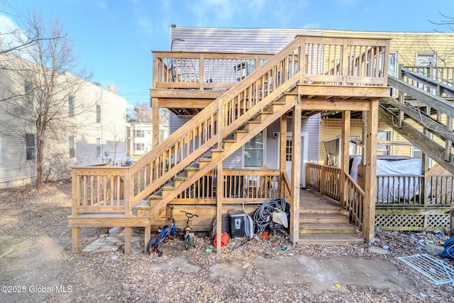 rear view of house with a wooden deck