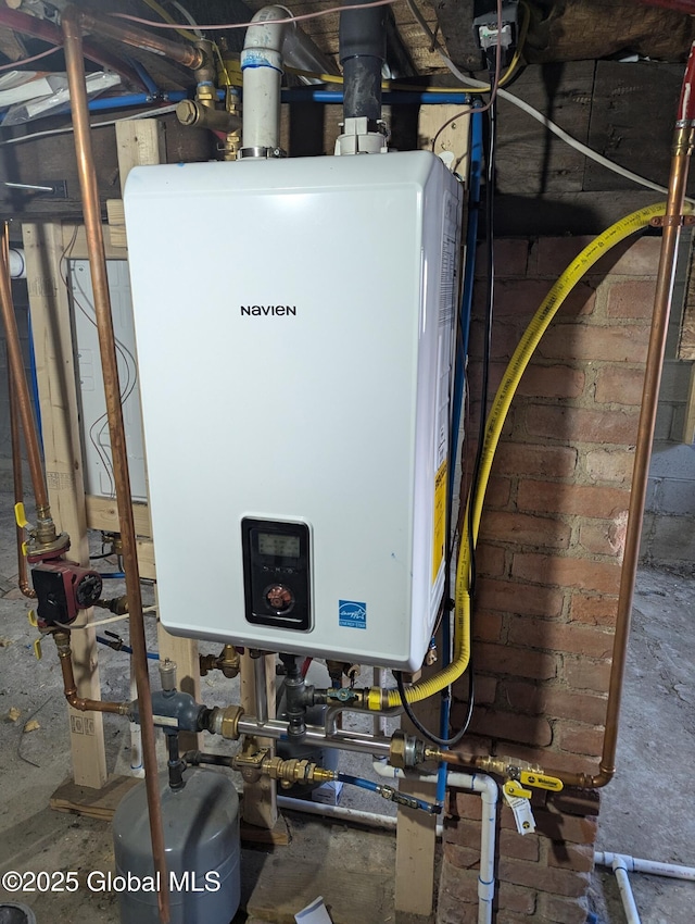 utility room featuring water heater