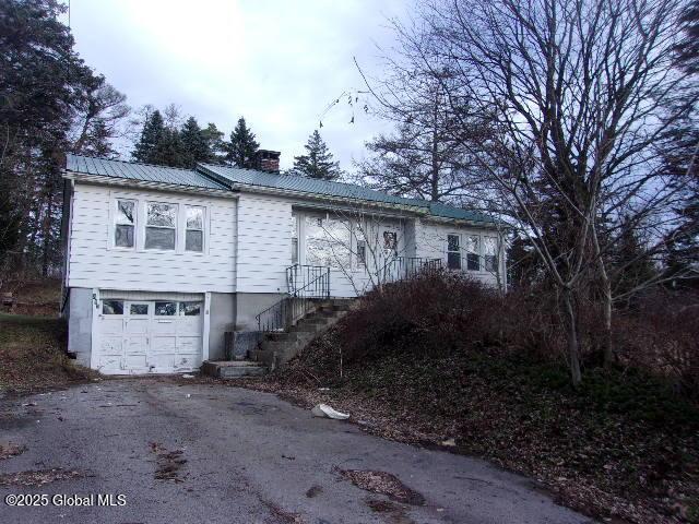 view of side of home featuring a garage